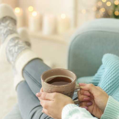 Time for Thyme Tea A lady is enjoying a nice cup of Thyme tea in her chair.