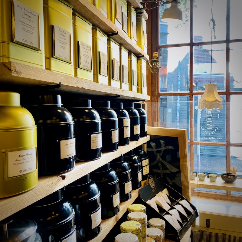 Interior photo of Tea Shop The Smallest House Interior photo of a row of tea tins in the Smallest House in Amsterdam