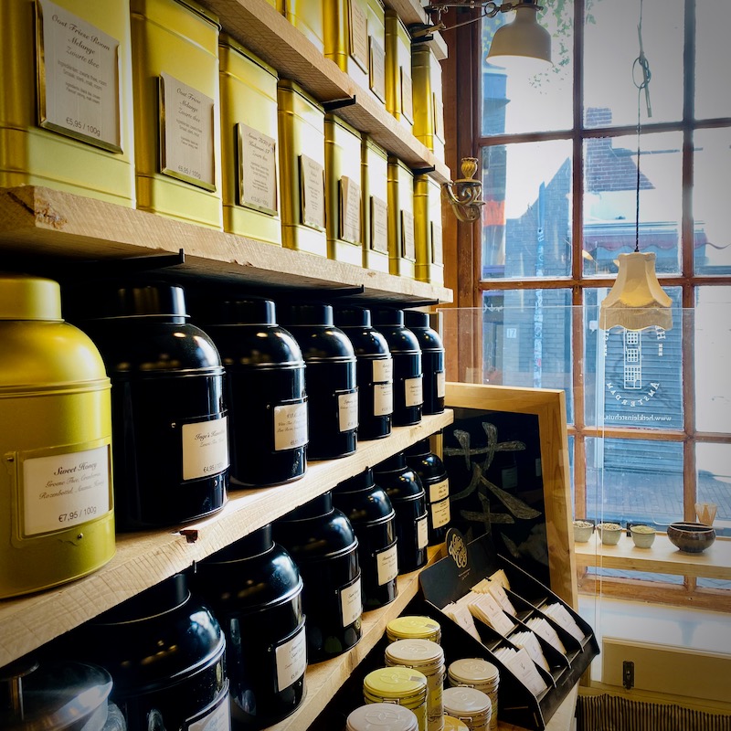 Interior photo of a row of tea tins in the Smallest House in Amsterdam