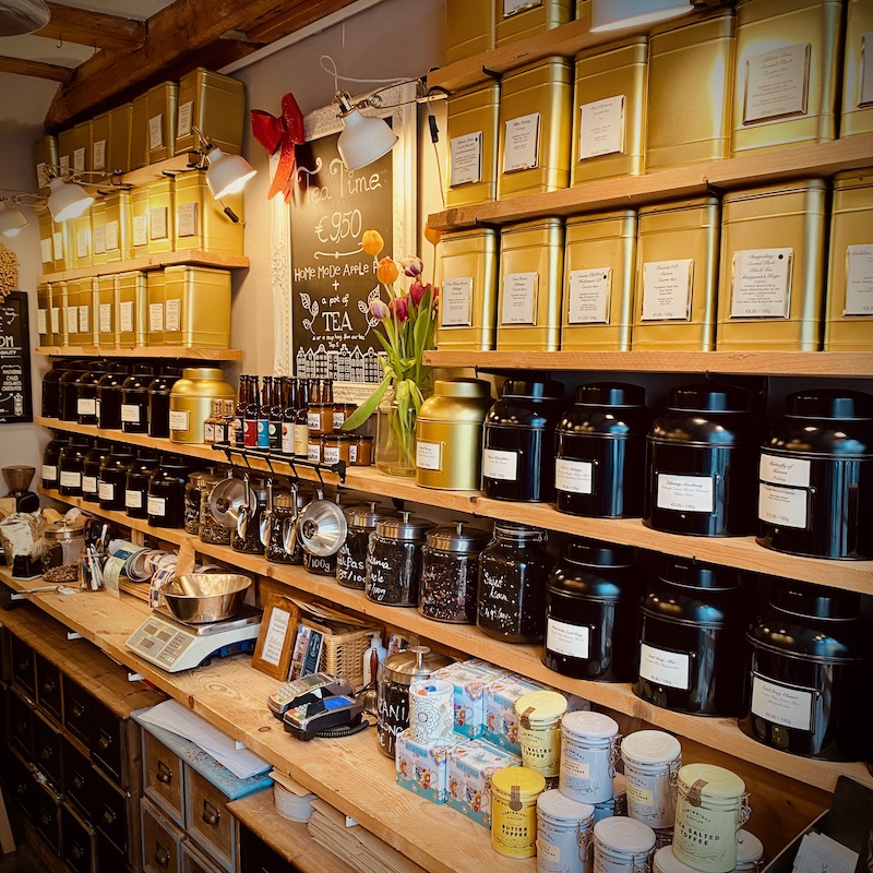 Interior of the tea shop The Smallest House in Amsterdam. Tea caddies filled with freshly loose leaf tea.